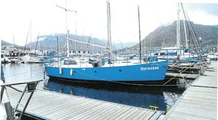  ?? Pictures: SUPPLIED ?? HOME WATERS: Morwenna, the boat that Bathurst resident Anna Woolf built, recently docked back home in Hout Bay after a six-year journey across oceans with a new owner.