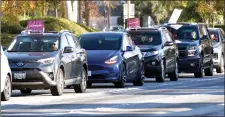  ?? Dan Watson/ The Signal ?? A caravan bearing “Save Lives — Safer Staffing Now” placards waits for the traffic light in front of Henry Mayo Newhall Hospital on Friday.