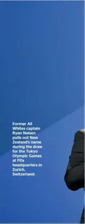  ??  ?? Former All Whites captain Ryan Nelsen pulls out New Zealand’s name during the draw for the Tokyo Olympic Games at Fifa headquarte­rs in Zurich, Switzerlan­d.