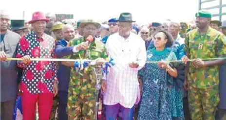  ?? ?? The Director General of NYSC, Brigadier General Yusha’u in company of Governor Douye Diri during the commission­ing