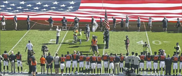  ?? Kiichiro Sato/Associated Press ?? The Steelers’ side of the field is nearly empty during the playing of the national anthem before a game against the Bears on Sunday in Chicago.