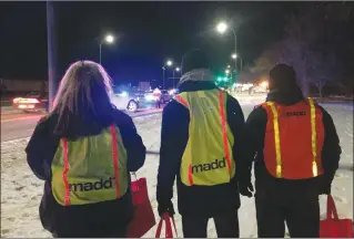  ?? Herald photo by Al Beeber ?? Members of Mothers Against Drunk Driving were onhand for a Lethbridge Police Service Check Stop Saturday evening.