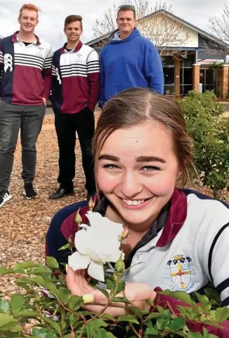  ?? Photo: Bev Lacey ?? SCHOOL ENTRY: Christian Outreach College student Elijsha Davey (front) with (back, from left) Noah Goodfellow, Stephan Barkhuizen and grounds manager Brendan Ott gear up for the Chronicle Garden Competitio­n.