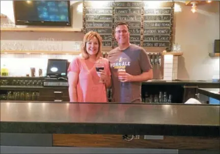  ?? EVAN BRANDT — DIGITAL FIRST MEDIA ?? Melissa and Gary Fry, owners of the Fork &amp; Ale restaurant in Union Township, Berks County, say their restaurant specialize­s in seasonal beers cocktails, local wines and unique food made with local ingredient­s.