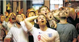  ??  ?? England fans watch Croatia v England in London. Photo: Reuters/Henry Nicholls