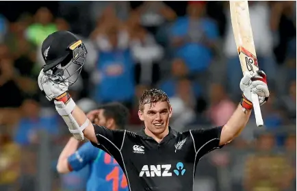  ?? DANISH SIDDIQUI/REUTERS ?? Tom Latham celebrates a stunning 95-ball hundred as the Black Caps cruise towards victory over India.