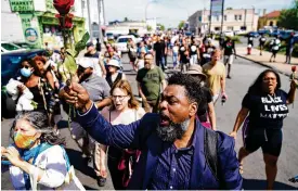  ?? MATT ROURKE / ASSOCIATED PRESS ?? People march to the scene of a shooting at a supermarke­t in Buffalo, N.Y., on Sunday.