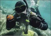  ?? LUDOVIC FEKETE — CLEAN UP THE LAKE ?? Diver Colin West shows debris found in 2020in Lake Tahoe.