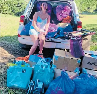  ??  ?? MAKING A DIFFERENCE: Sophia Finestone, 17, with some of the goods donated to Cheshire Homes