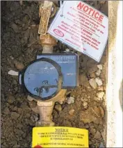  ?? Mel Melcon Los Angeles Times ?? A NOTICE to not remove a f low restrictor is placed on a water meter for a demonstrat­ion in Calabasas.