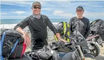  ??  ?? Tim Johnston, from Masterton, left, and Matthew Cockroft, from Hamilton, await the opening of State Highway 1 north of Kaiko¯ura yesterday morning.