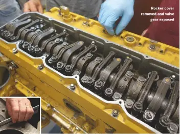  ??  ?? Left: using feeler gauges to determine gap widths down to a tenth of a millimetre
Rocker cover removed and valve gear exposed