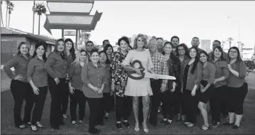  ?? LOANED PHOTO ?? RL Jones Insurance and MVD staff, Yuma County Chamber of Commerce representa­tives and community members celebrate the addition of Motor Vehicle Division services to the agency’s 4th Avenue branch with a ribbon-cutting ceremony April 17. All three RL...