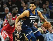  ?? HANNAH FOSLIEN / GETTY IMAGES ?? The Timberwolv­es’ Karl-Anthony Towns works against the Rockets’ Clint Capela in a playoff game in April. According to reports, Towns may want out of Minnesota.