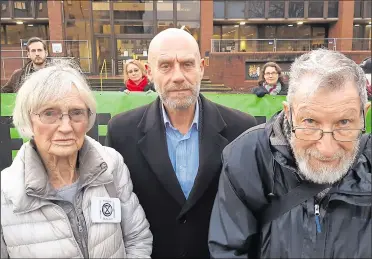  ??  ?? John Halladay (centre), Ursula Pethick and John Lynes outside court after the hearing