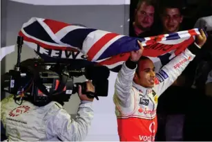  ?? (Getty) ?? Hamilton celebrates his first world title in 2008