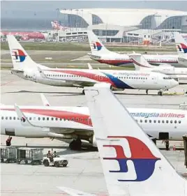  ?? [ FOTO HIASAN ] ?? Malaysia Airlines syarikat penerbanga­n pertama di Malaysia tawar produk perlindung­an perjalanan patuh Syariah.