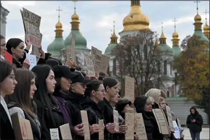  ?? SERGEI SUPINSKY — AFP/GETTY IMAGES ?? Relatives of Ukrainian Azov regiment war prisoners hold placards during a rally calling for their quick exchange with Russian prisoners of war on Wednesday at St. Sophia Square in Kyiv.