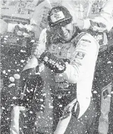  ?? BRIAN LAWDERMILK/GETTY ?? Chase Elliott celebrates after winning Sunday’s NASCAR Cup race at The Glen.