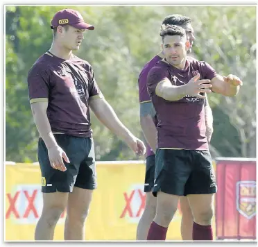  ?? Photo: Jono Searle/Getty Images ?? APPRENTICE AND MASTER: Maroons debutant Kalyn Ponga gets some advice from Queensland great Billy Slater during a training session at Sanctuary Cove on Wednesday.