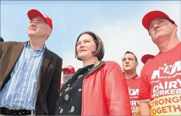  ??  ?? Looking for answers . . . Labor candidate for Nicholls Bill Lodwick, Shadow Assistant Workplace Relations Minister Lisa Chester and National Union of Workers’ Victorian lead dairy organiser Neil Smith at Pactum Dairy in Shepparton on Thursday.