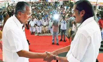  ?? S. MAHINSHA ?? Over to campaign trail: Chief Minister Pinarayi Vijayan with LDF candidate Pannian Raveendran during a poll convention in Neyyattink­ara on Saturday.