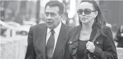  ?? | KEVIN TANAKA/FOR SUN-TIMES MEDIA ?? Joseph Mario Moreno and his wife, Nancy, leave court Wednesday after the former Cook County Commission­er received an 11-year sentence.
