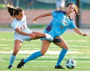  ?? STEPHEN M. KATZ/STAFF ?? Princess Anne’s Isabella Cobos, left, and First Colonial’s Juliann Rink battle for the ball during Wednesday’s Class 5 Region A girls soccer semifinal at Bayside High.