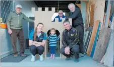  ?? Photo / Laurilee McMichael ?? Amiria-Marie Rawiri, 2, from Top Kids Motutaiko in one of the finished playhouses. With her is (back row from left) Joe Ridley, Dave Herd, Frederik Frank. Top Kids Motutaiko teacher Amanda Lockwood and Warren Johnson of ITM Taupo¯ are in front.