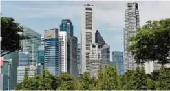  ??  ?? SINGAPORE: A general view shows office buildings in the financial district in Singapore yesterday. —AFP