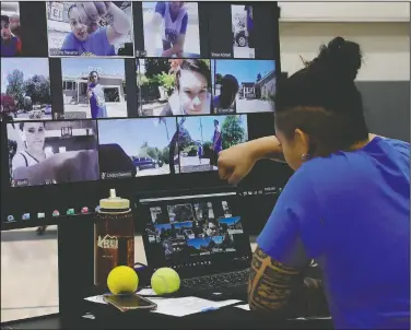  ??  ?? Navarro has an online fist bump with students including Bjarki Robertsson (lower left on screen) of Reykjavik, Iceland, at Golden State Warriors basketball camp.