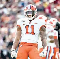  ?? AP Photo/Sean Rayford ?? ■ Clemson linebacker Isaiah Simmons (11) celebrates a stop against South Carolina on Nov. 30 in Columbia, S.C. Simmons was selected to The Associated Press All-America team Monday.