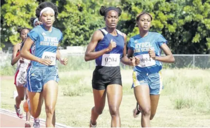  ??  ?? Oneika Brissett (centre) was first in the Class Two 800m in 2:26.98 minutes, ahead of the Hydel High pair of Dannielle King (left) in 2:28.04 minutes and Dejona Simpson (right) in 2:29.57 minutes.