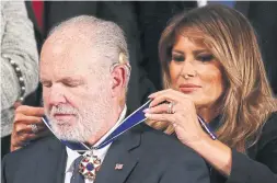  ?? MARIO TAMA GETTY IMAGES ?? Melania Trump giving Rush Limbaugh a Presidenti­al Medal of Freedom during the state of the union address was designed for social media, Jaime Watt writes.