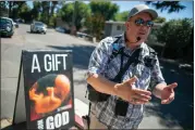  ?? ANDA CHU — STAFF PHOTOGRAPH­ER ?? Anti-abortion activist James Cook, a pastor in Concord, speaks outside a Planned Parenthood clinic in Walnut Creek on June 24, 2022.