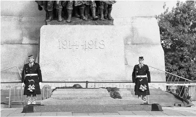  ??  ?? The last known picture taken of Cpl. Nathan Cirillo before he was shot while standing guard at the National War Memorial on Oct. 22, 2014 was captured seconds before the shooting began by a French tourist waiting nearby for a tour bus. Cirillo, left,...