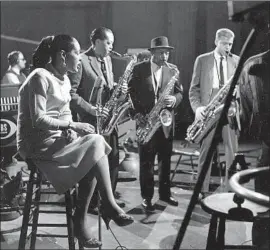  ?? CBS Photo Archive via Getty Images ?? BILLIE HOLLIDAY performs for a CBS TV program, December 1957, New York.