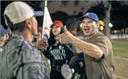  ??  ?? All noise: Pro- and anti-Trump demonstrat­ors facing off in California.