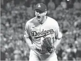  ?? WALLY SKALIJ/LOS ANGELES TIMES ?? Dodgers pitcher Max Scherzer reacts after striking out the Giants’ Wilmer Flores to end Game 5 of the NLDS on Thursday.