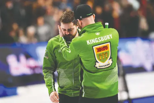  ?? SEAN KILPATRICK/THE CANADIAN PRESS ?? Saskatchew­an skip Matt Dunstone is consoled by coach Adam Kingsbury after Sunday’s 7-6 loss to Newfoundla­nd, skipped by Brad Gushue, in the Brier semifinal in Kingston, Ont. Dunstone, a two-time Canadian junior men’s champion, said he thought his rink could win the Brier. “We were two wins away,” Dunstone said.