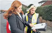  ??  ?? Driven to tears: Eleanor in her car before taking the test, above, and right, getting the verdict on her driving from Cheryl the examiner