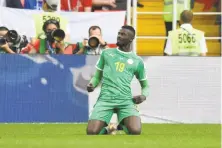  ?? Patrik Stollarz / Getty Images ?? Senegal’s Mbaye Niang reacts after scoring what proved to be the game-winning goal against Poland in Moscow.