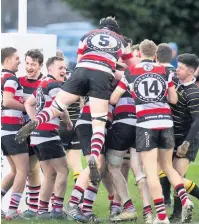  ??  ?? Well done Try scorer George Arnott is underneath a pile of colleagues after going over