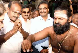  ?? — PTI ?? Karnataka chief minister H. D. Kumaraswam­y visits the Meenakshi Amman Temple in Madurai on Friday.