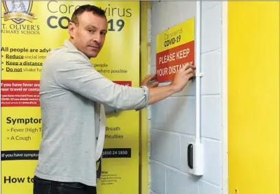  ?? Photo by Michelle Cooper Galvin ?? St Oliver’s Primary School Killarney Principal, Rory D’Arcy, preparing his school to re-open with Covid-19 restrictio­ns in place. The school is divided into areas with a fob system to enter different coloured areas.