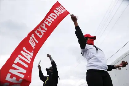  ?? Photograph: Chip Somodevill­a/Getty Images ?? Black Lives Matter and Long Live Go Go Crew participat­es in an ‘Essential, Not Expendable’ demonstrat­ion and rally during the coronaviru­s pandemic 0n 27 April in Washington DC.