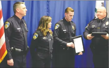  ?? CHRISTINA CORNEJO/NEWS-SENTINEL ?? From left: Officer Brannon Haro, Dispatcher Jayma Sareeram and Officer William Hinton accepted their Life Saving Award for preventing an inmate from taking his life in the Lodi City Jail during the annual Law Enforcemen­t Recognitio­n Awards Ceremony on...