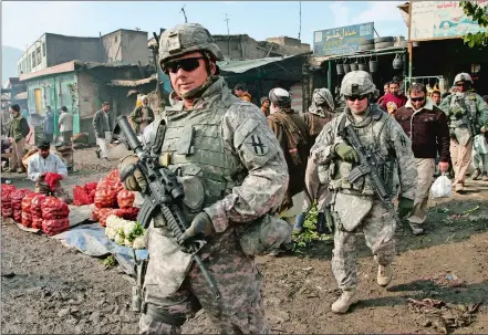  ?? MUSADEQ SADEQ/AP PHOTO ?? U.S. soldiers patrol through the heart of Kabul, Afghanista­n, in 2009.