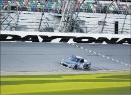  ?? JOHN RAOUX/ THE ASSOCIATED PRESS ?? Kyle Larson drives through the front stretch Friday during practice for Saturday’s 20-car NASCAR Clash at Daytona Internatio­nal Speedway in Daytona Beach, Fla.