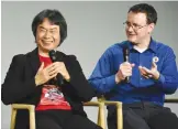  ??  ?? NEW YORK: Japanese video game designer and producer Shigeru Miyamoto, left, and Senior Product Marketing Manager of Nintendo of America and interprete­r, Bill Trinen, make an appearance at the Apple SoHo store to promote Super Mario Run for iOS. — AP